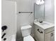 Cozy bathroom features a toilet, shower/tub, and a vanity with black hardware at 405 Sora Dr, Stockbridge, GA 30281