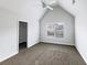 Bedroom features a ceiling fan, closet, and a window at 405 Sora Dr, Stockbridge, GA 30281