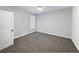 Bedroom features neutral walls, a ceiling fan, carpet floors and a bright, inviting atmosphere at 405 Sora Dr, Stockbridge, GA 30281