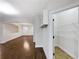 Hallway featuring hardwood floors and a walk-in pantry with white shelving at 405 Sora Dr, Stockbridge, GA 30281