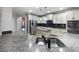 Modern kitchen with granite countertops, stainless steel appliances and dark backsplash at 405 Sora Dr, Stockbridge, GA 30281