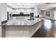 Modern kitchen features white cabinets, stainless steel appliances, and granite countertops at 405 Sora Dr, Stockbridge, GA 30281