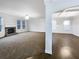 Expansive living room with a stone fireplace, and beautiful hardwood floors at 405 Sora Dr, Stockbridge, GA 30281