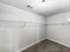 Spacious walk-in closet with ample shelving and rod space for organized storage at 405 Sora Dr, Stockbridge, GA 30281