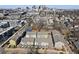 Aerial view of a neighborhood with multiple rows of modern townhomes near the city skyline at 68 Adore Se Ct, Atlanta, GA 30315