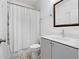 Neutral bathroom featuring a combined shower and tub with a white curtain and a vanity at 68 Adore Se Ct, Atlanta, GA 30315