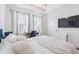 Bright bedroom featuring modern decor, desk area, and large windows at 68 Adore Se Ct, Atlanta, GA 30315