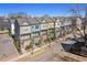 Beautiful row of colorful townhomes with street lamps and sidewalks at 68 Adore Se Ct, Atlanta, GA 30315