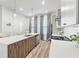 Modern kitchen features a breakfast bar, stainless steel appliances, and gray cabinets at 68 Adore Se Ct, Atlanta, GA 30315