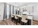 Modern kitchen features a breakfast bar, stainless steel appliances, and gray cabinets at 68 Adore Se Ct, Atlanta, GA 30315