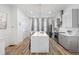 Modern kitchen features a breakfast bar, stainless steel appliances, and gray cabinets at 68 Adore Se Ct, Atlanta, GA 30315