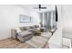 Cozy living room boasts a comfortable sectional sofa, ceiling fan, and a stylish rug at 68 Adore Se Ct, Atlanta, GA 30315