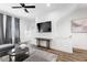 Bright living room featuring a ceiling fan, gray drapes, modern furniture, and a flatscreen TV at 68 Adore Se Ct, Atlanta, GA 30315