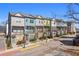 Charming townhome row showcasing colorful facades, balconies, street lamps and sidewalks at 68 Adore Se Ct, Atlanta, GA 30315