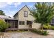 Charming home featuring a well-maintained yard and inviting covered porch and side porch at 1015 Loliver Ln, Chattahoochee Hills, GA 30268