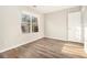 Bright bedroom with wood-look floors, neutral walls, and a window view at 1534 Norman Xing, Atlanta, GA 30349