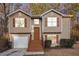 Charming two-story home featuring a well-maintained lawn, neutral siding, and classic shutters at 1534 Norman Xing, Atlanta, GA 30349
