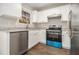 Modern kitchen featuring stainless steel appliances, granite counters, and ample storage space at 1534 Norman Xing, Atlanta, GA 30349