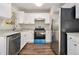 Modern kitchen featuring stainless steel appliances, granite counters, and ample storage space at 1534 Norman Xing, Atlanta, GA 30349