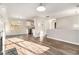 Open-concept living room with hardwood floors, large windows and ample natural light at 1534 Norman Xing, Atlanta, GA 30349
