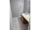 Neutral bathroom with large mirror, white countertop, toilet, and tiled floor at 4233 Viewpoint Ln, Ellenwood, GA 30294