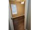 Cozy bedroom featuring a window and light walls, and beautiful laminate wood flooring at 4233 Viewpoint Ln, Ellenwood, GA 30294