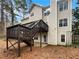 Backyard showing elevated deck and stairs to patio at 155 Mine Run, Fayetteville, GA 30215