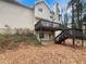 Backyard showing elevated deck and stairs to patio at 155 Mine Run, Fayetteville, GA 30215