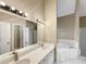 Bathroom featuring double sinks and a soaking tub at 155 Mine Run, Fayetteville, GA 30215