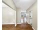 Bright hallway with hardwood floors leading to other rooms of the house at 155 Mine Run, Fayetteville, GA 30215