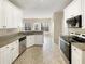 Kitchen with white cabinets and stainless steel appliances at 155 Mine Run, Fayetteville, GA 30215
