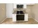 Well-equipped kitchen with stainless steel appliances, granite countertops, and white cabinetry at 155 Mine Run, Fayetteville, GA 30215