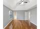 Bedroom featuring a tray ceiling and hardwood floors at 155 Mine Run, Fayetteville, GA 30215
