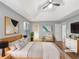 A spacious bedroom featuring a tray ceiling and hardwood floors at 155 Mine Run, Fayetteville, GA 30215
