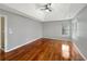 Spacious main bedroom features hardwood floors, a ceiling fan, and plenty of natural light at 155 Mine Run, Fayetteville, GA 30215