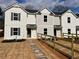 Modern townhome exterior featuring a stone pathway, freshly laid grass and a white and gray facade at 229 Evergreen Trl # D, Cartersville, GA 30121