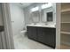 Bathroom with double vanity, quartz countertops, modern fixtures, and tile floors offers convenience and style at 229 Evergreen Trl # D, Cartersville, GA 30121