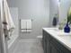 Bathroom vanity with double sinks, quartz countertops, and tile floors exude sophistication and elegance at 229 Evergreen Trl # D, Cartersville, GA 30121
