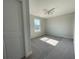Bright bedroom featuring a ceiling fan, window and soft carpet at 229 Evergreen Trl # D, Cartersville, GA 30121