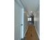 Bright hallway featuring neutral walls, modern lighting, and access to various rooms at 229 Evergreen Trl # D, Cartersville, GA 30121