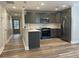 Modern kitchen with stainless steel appliances, island and gray cabinetry at 229 Evergreen Trl # D, Cartersville, GA 30121