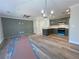 Open-concept living space features sleek flooring, modern lighting, and a stylish accent wall at 229 Evergreen Trl # D, Cartersville, GA 30121