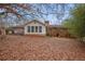 Spacious backyard featuring a sunroom, brick exterior, and lush greenery at 3948 Bright Star Rd, Douglasville, GA 30135