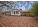 Expansive backyard view showcasing the home's sunroom and deck, ideal for outdoor living and entertaining at 3948 Bright Star Rd, Douglasville, GA 30135