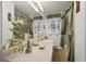 Bathroom featuring a countertop, decorative mirror, and greenery at 3948 Bright Star Rd, Douglasville, GA 30135