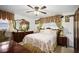 Relaxing bedroom with a ceiling fan, decorative mirror, and lots of natural light at 3948 Bright Star Rd, Douglasville, GA 30135