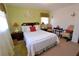 Cozy bedroom featuring green walls, a comfortable queen-sized bed, and carpet flooring at 3948 Bright Star Rd, Douglasville, GA 30135