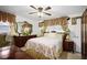Comfortable bedroom with ceiling fan, dresser, lamps, mirror and large window at 3948 Bright Star Rd, Douglasville, GA 30135