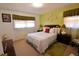 Relaxing bedroom with bright green walls, a comfy bed, and carpet flooring at 3948 Bright Star Rd, Douglasville, GA 30135
