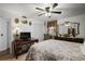 Bedroom featuring a ceiling fan, decorative mirror, and lots of natural light at 3948 Bright Star Rd, Douglasville, GA 30135